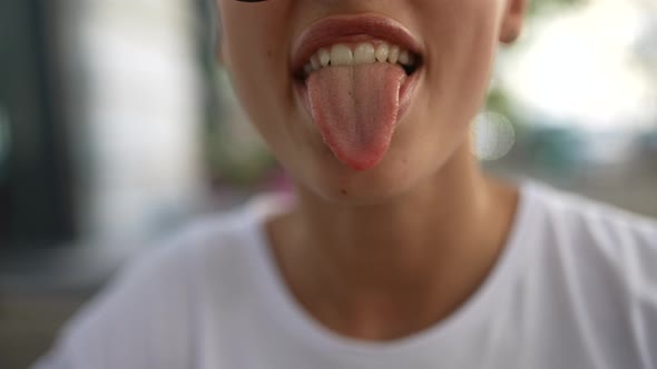 Girl's Mouth Closeup Moves Lips and Shows Tongue