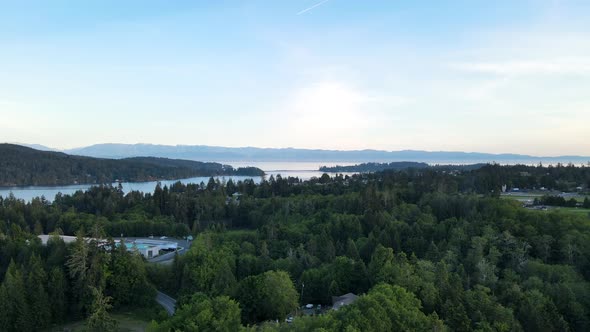 Aerial footage of pacific ocean view with peninsulas in the foreground and mountains of Washington s