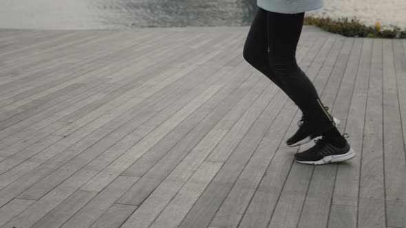 Fitness Woman in Hijab Jogging Near City River