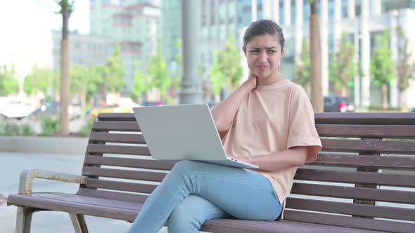 Indian Woman Having Neck Pain While Using Laptop in Office