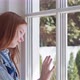 Sad Teen Girl Looking Out Window at Home Isolation - VideoHive Item for Sale