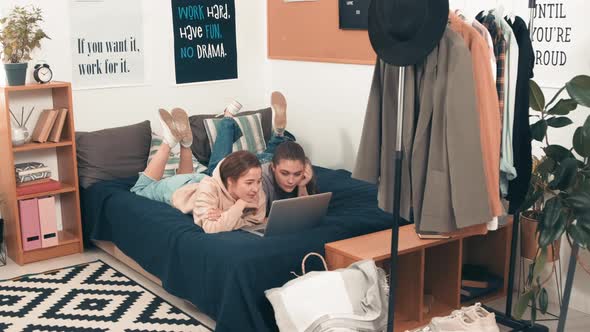 Female Friends Watching Movie on Laptop