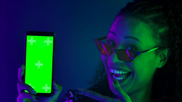 Portrait Young Lovely Female African American Stylish Sunglasses Points Finger Smartphone Green