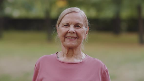 Portrait of Happy Senior Woman Outdoors