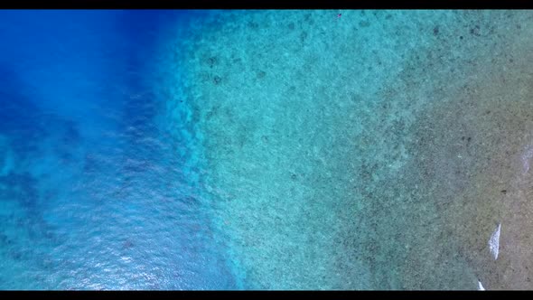 Aerial top view sky of relaxing seashore beach adventure by turquoise sea and white sandy background