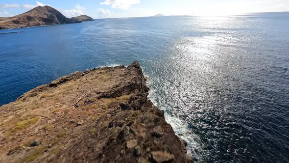 FPV Racing Drone Mountain Surfing and Cliff Diving Along the Rocks