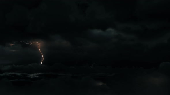 Aerial Wide Shot of Dark Tropical Monsoon Cyclone Supercell Thunderstom Storm Clouds with Lightning