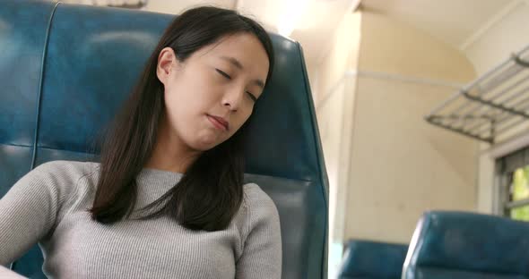 Woman go travel and sleeping on train