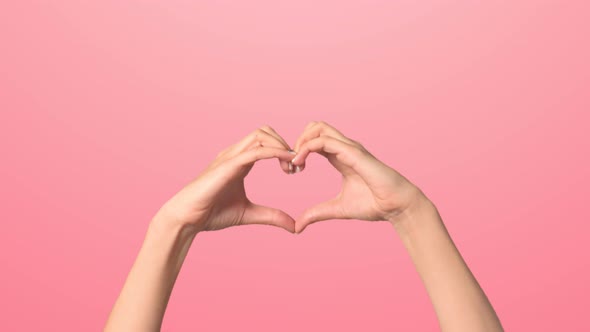 Women's Hands Fold the Heart. Close-up of Women's Hands in the Shape of a Heart