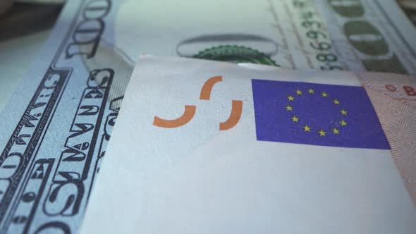 American Dollar Bill and European Union Money Euro in Macro Shot. EU Sign with Blue Background and