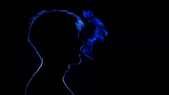 Man Lighting Cigarette, Back Light, Silhouette