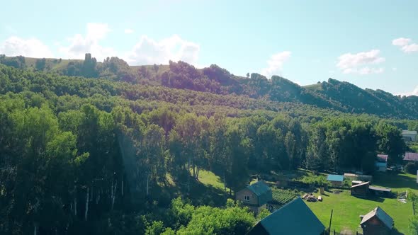 Aerial Shot Top View of the Tourist City Mountains Pine and Deciduous Forest Mountain River 2