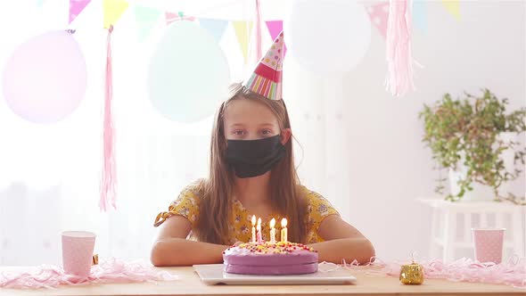 Caucasian Girl Is Dreamily Smiling and Looking at Birthday Rainbow Cake. Festive Colorful Background