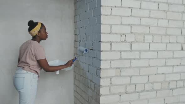 African-American Woman Renovating Apartment