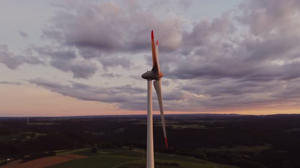 Wind Turbine in the Bright Rays of the Rising Sun Bird's Eye View