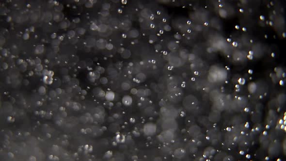 Water drops on glass on a black background. Close up