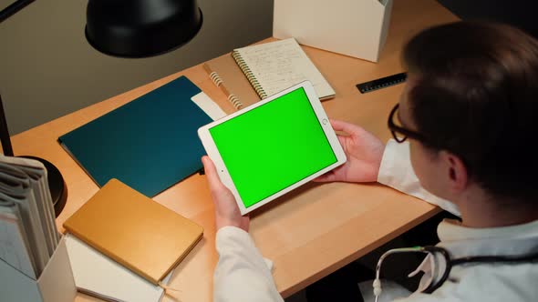 Doctor Using Gadget Tablet with Green Chroma Key Screen