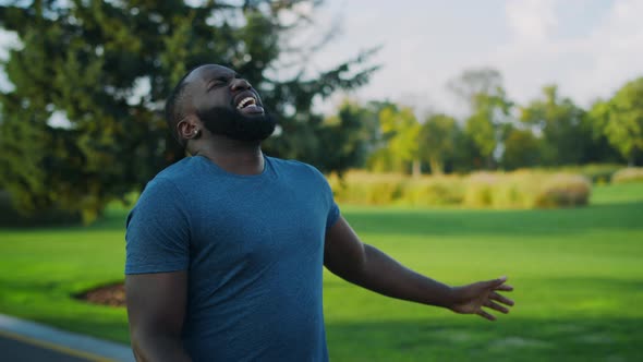 Tired Athlete Jogging in park.Sportsman Feeling Bad During Run Marathon Outdoors