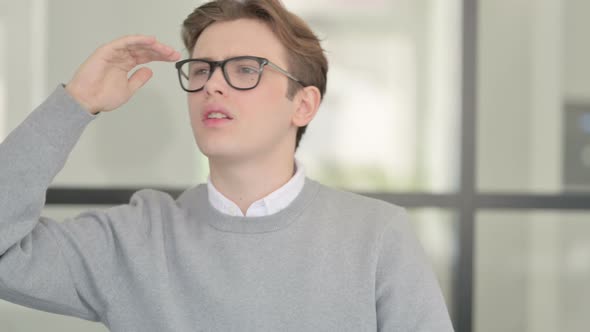 Portrait of Young Man Looking Around Searching