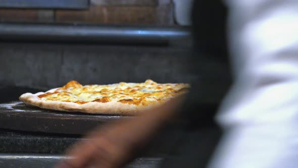 Slicing Pizza Ready for Serving