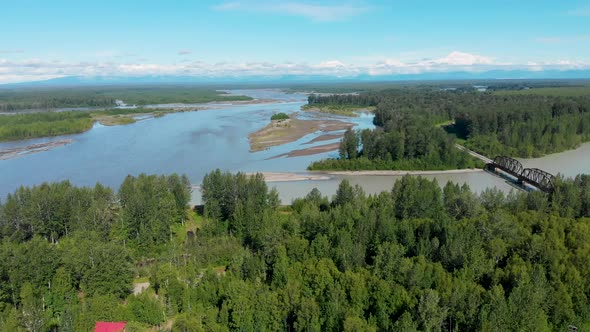 4K Drone Video of Alaska Railroad Train Trestle with Mt. Denali in Distance during Summer