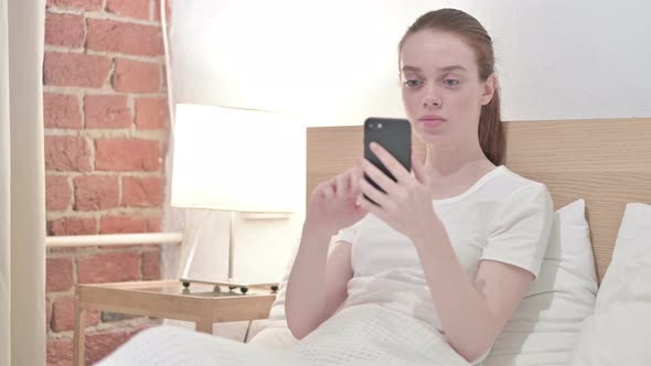 Hardworking Redhead Young Woman Having Failure on Smartphone 