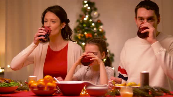 Happy Family Having Christmas Dinner at Home