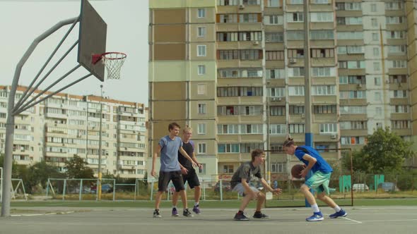 Teenage Friends Playing Streetball on Outdoor Court