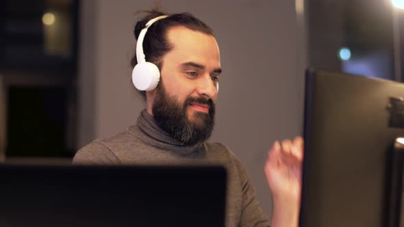 Man in Headphones Working with Computers at Office 32