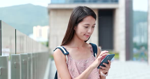 Woman use of cellphone in the city