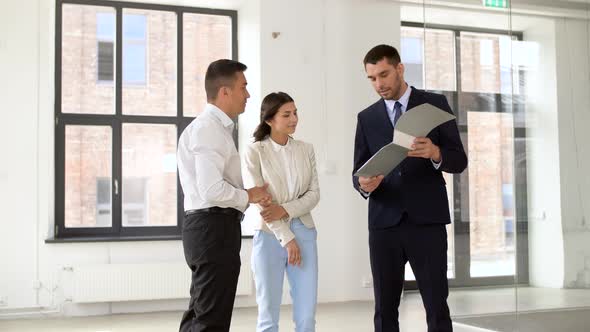 Realtor with Folder Showing Documents To Customers 30