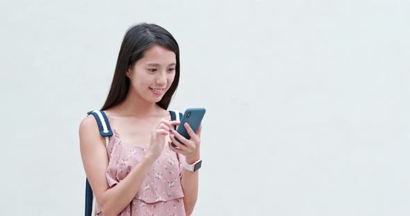 Woman use of mobile phone in the city