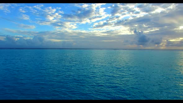 Aerial drone sky of exotic seashore beach adventure by blue green sea with bright sandy background o