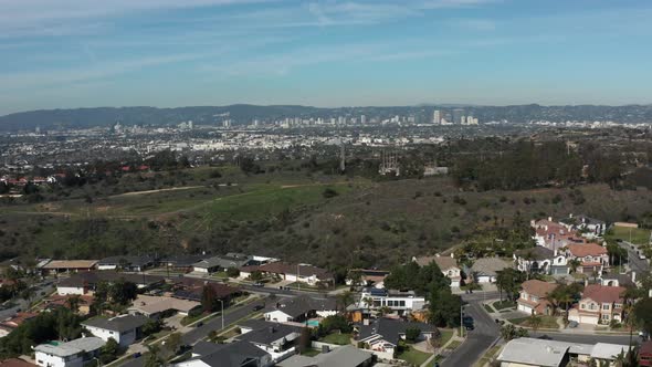 Aerial shot of a park with downtown Los Angeles in the background
