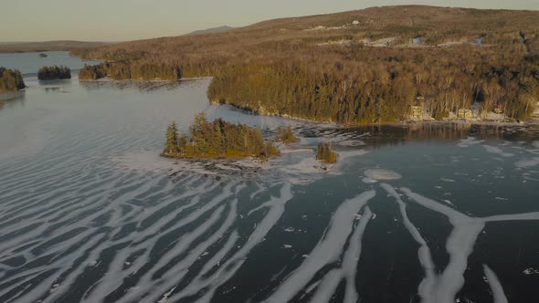 Houses on banks of Moosehead Lake. Maine. USA. Aerial wide circle