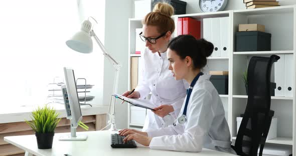 Female Doctors Working with Documents in the Office.