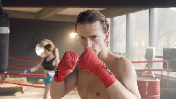 Portrait of Sport Man Standing in the Boxing Ring