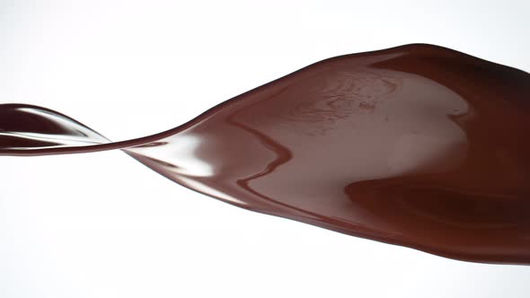 Super Slow Motion Shot of Twisting Chocolate Splash Isolated on White Background at 1000 Fps