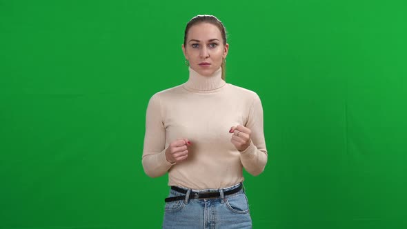Stressed Angry Young Woman Screaming at Chromakey Background Looking at Camera