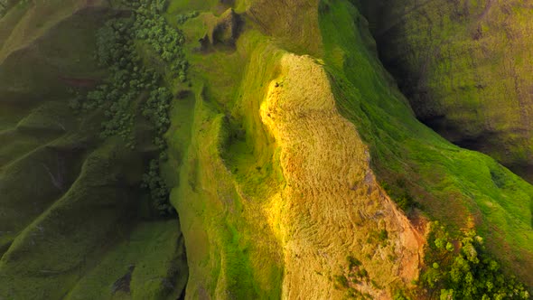 Aerial Green Cliffs Nature Background in Golden Sunset Light Mountains View
