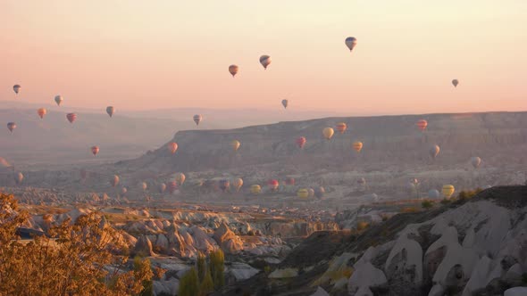 Hot Air Balloons Flying Over Mountains