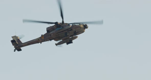 AH-64D Apache Longbow military helicopter during combat flight