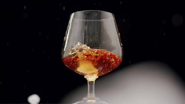 Strong Alcoholic Drink Whiskey Brandy Cognac in Glass with Ice Cubes Fall
