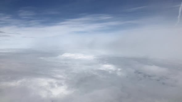 Flying through amazingly beautiful cloudscape. Picturesque timelapse of white fluffy clouds moving 