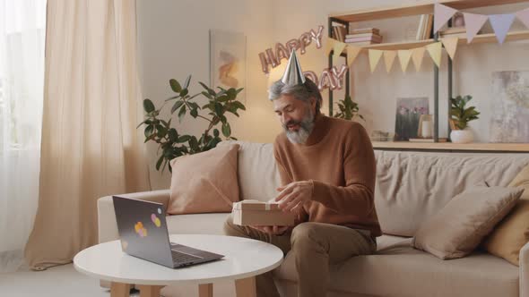 Man Having Online Birthday Party On Laptop