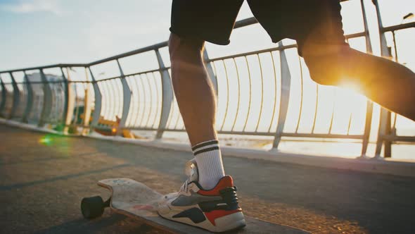 Close Up of Skater Man Riding Skateboard on Sunset Slow Motion