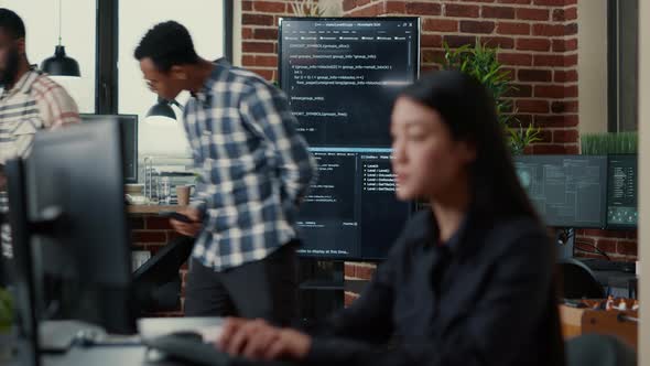 Programmers Leaving After Analyzing Source Code on Wall Screen Tv Comparing Errors Using Digital