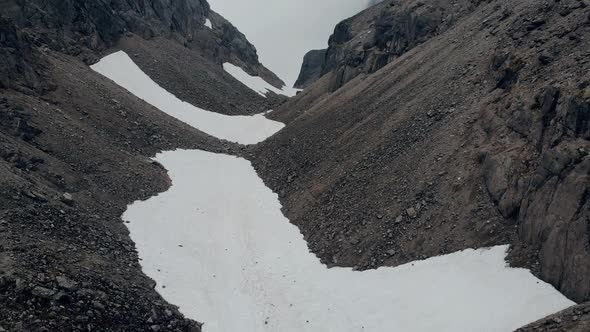 an Aerial Flight Through a Dark Muddy Gorge