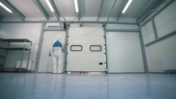 a Worker Opens a Department in a Warehouse