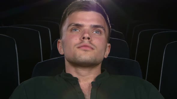 Boy Sitting at Cinema, Close Up